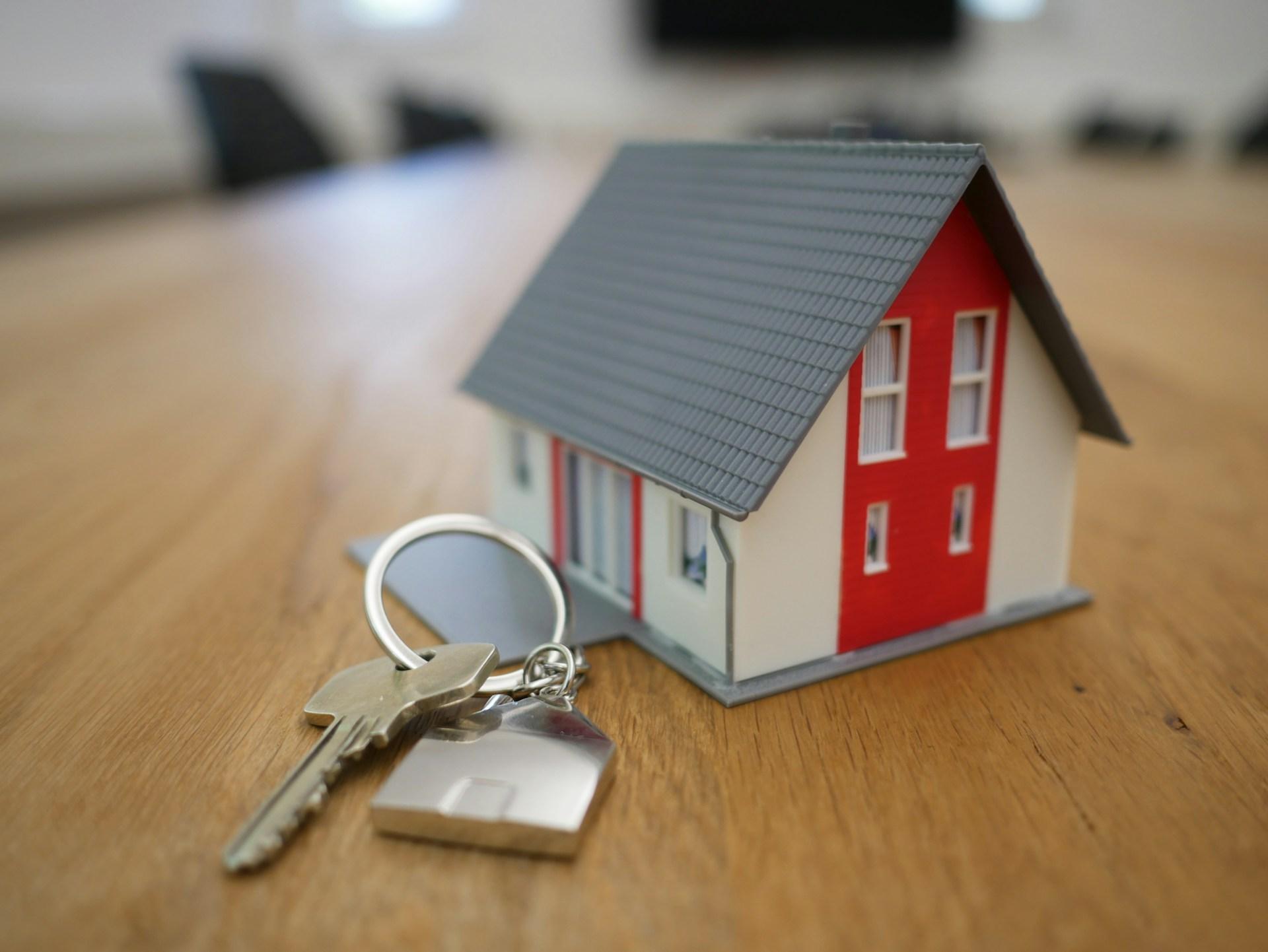 House keys on a table symbolizing home and stability.